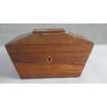 A Victorian mahogany sarcophagus shape box with with twin brass lion head handles. H.12 W.20cm