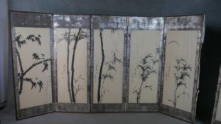 A Chinese six fold screen, each panel painted in black ink depicting bamboo, each with Chinese