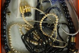 A boxed group of necklaces, including: a sapphire and white sapphire facetted bead necklace, an