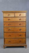 An ash tallboy chest of two short over five long graduated drawers with beaded borders, with