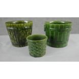 A collection of three various size 19th century pottery green glaze planters with different designs,