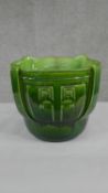 A large 19th century Bretby pottery green glaze planter with geometric design, impressed makers