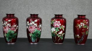 A Meji period Japanese ‘Sato’ cloisonné pair of vases, flowers on red ground and another matched