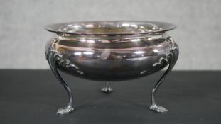 A circular silver bowl raised on three cabriole legs. Hallmarked: Mappin and Webb, Sheffield,