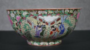 A Cantonese Famille Rose hand painted large bowl with figural design and flowers. Six character mark