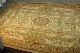 An Aubusson beige ground hand made carpet. L.365 W.273cm.