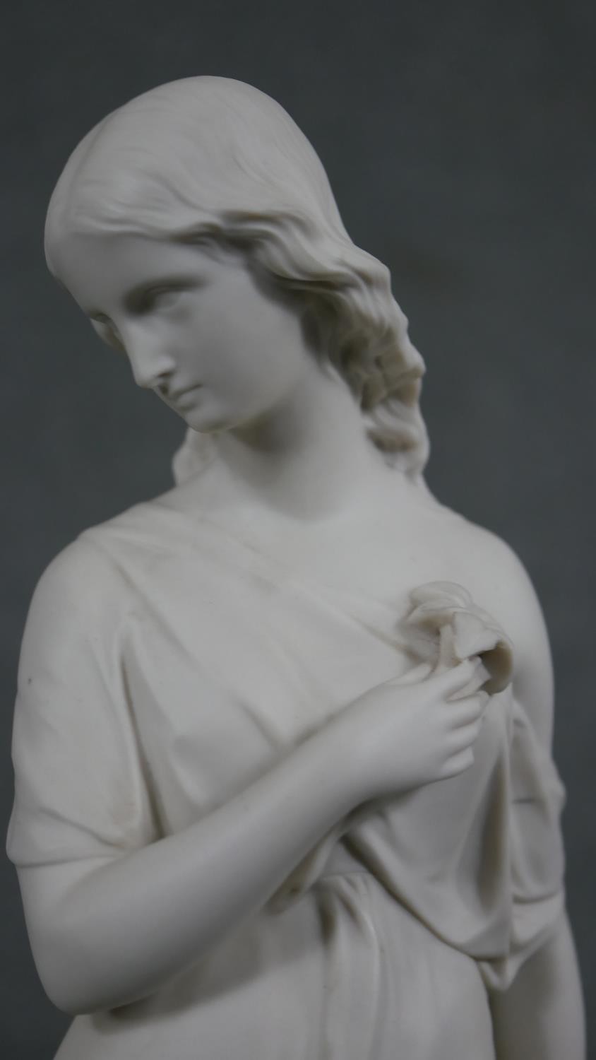 A Copeland Parian ware figure of a girl standing holding a flower to her breast, gilt border to - Image 7 of 12