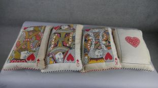 A set of four playing card cushions, comprising the King of Hearts, Queen of Hearts, Jack of