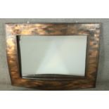 A contemporary copper framed mirror, of rectangular form with a lattice design undulating frame. H.