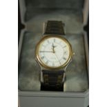 A boxed stainless steel quartz ‘Conquest’ watch, by Longines, with date aperture, bi-coloured