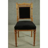 A late 19th century Continental side chair, with turned spindles over a back and seat upholstered in