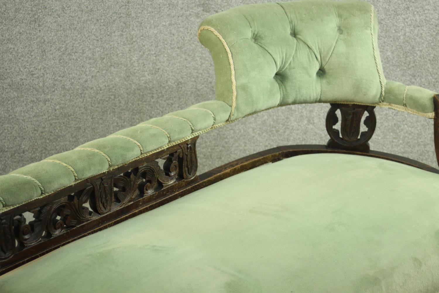 An Edwardian chaise longue, upholstered in green buttoned velour, the back panel carved and - Image 5 of 8