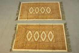 Two small Bokhara motif rugs. L.110 W.68cm.
