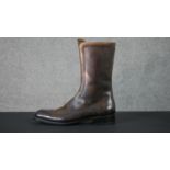 A pair of men's brown leather Gucci zip up boots, with Gucci stamped soles and zips. Size 9.