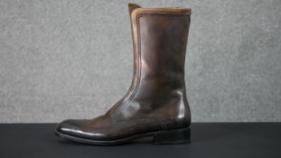 A pair of men's brown leather Gucci zip up boots, with Gucci stamped soles and zips. Size 9.