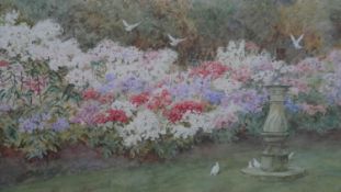 Thomas Nicholson Tyndale (British 1860-1930), flowers beside a birdbath, watercolour, signed lower