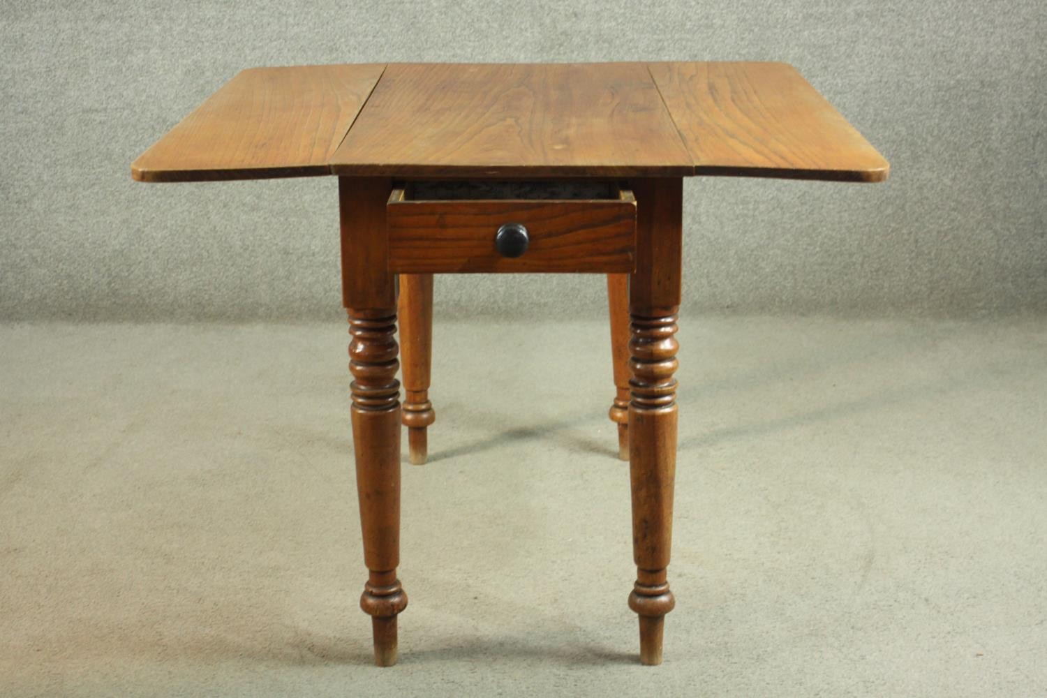 A Victorian Pembroke table, with drop leaves over an end drawer, on turned legs. H.70 W.44 D. - Image 7 of 7