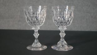 A pair of large early 20th century petal cut goblets with blown glass stems. H.18 Diam.10cm (