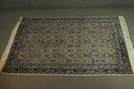 An Indian Agra part silk cream ground hand made rug. L.180 W.126cm.