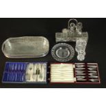 A collection of silver plate and glass, including two boxed sets of cake forks, an engraved