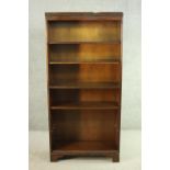 A mahogany bookcase, with a dentil cornice over five shelves, on shaped bracket feet. H.170 W.80 D.