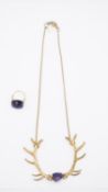 A gold tone metal deer antler necklace with amethyst bead to centre along with a yellow metal wire