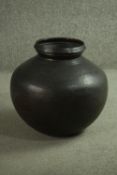 A large bronze effect hammered design brass vase. H.47 Dia.45cm.