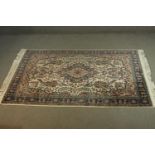 An Indian part silk Agra cream ground hand made rug. L.190 W.124cm.