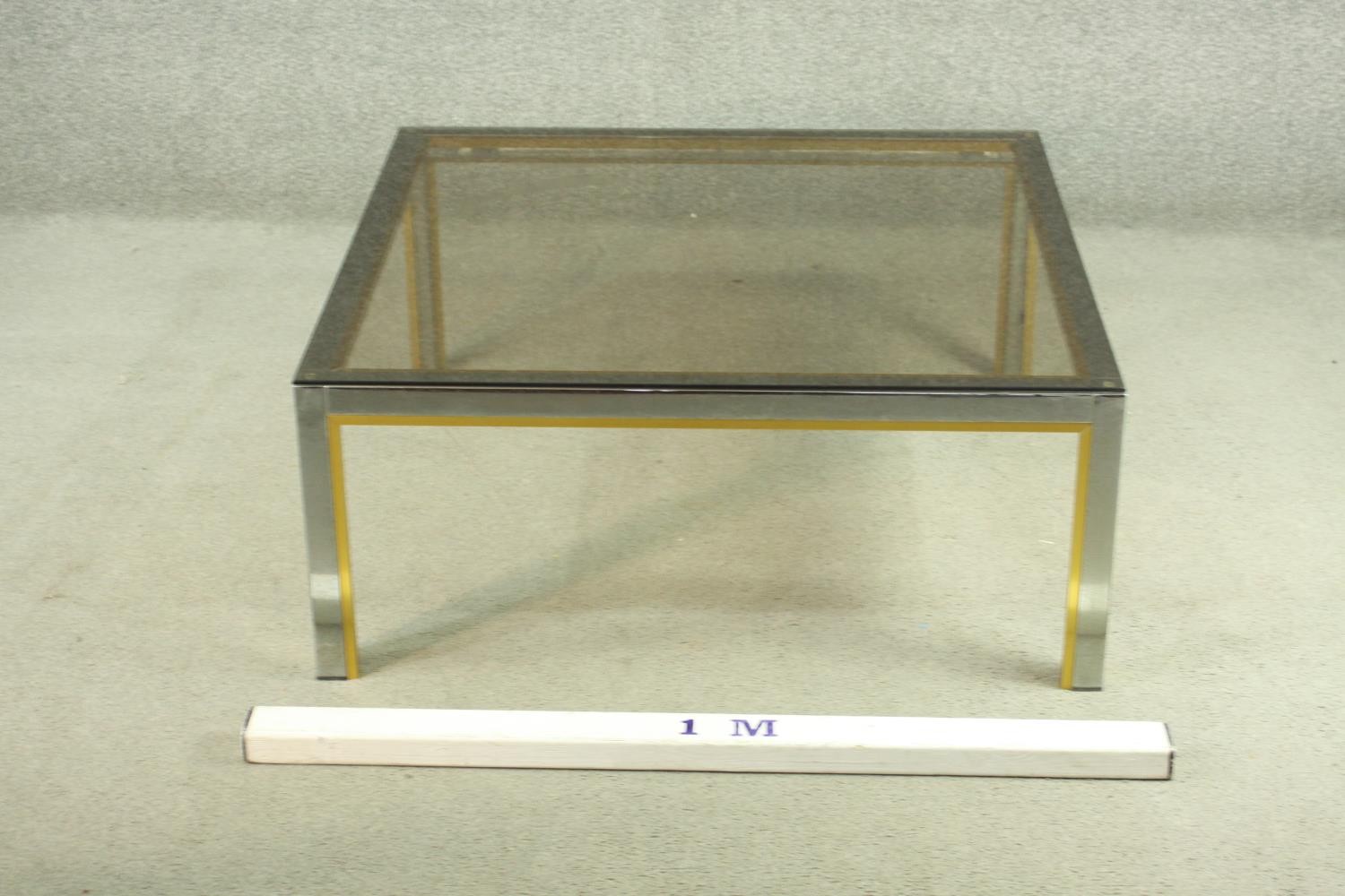 Manner of Janetti, a 1970's coffee table, with a tinted glass coffee top on a chrome and brass - Image 2 of 4