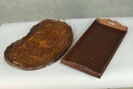 An Edwardian Sheraton Revival marquetry inlaid mahogany tray, of kidney shaped, with two brass