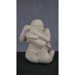 A 20th century carved limestone sculpture of mother and child. H.32 W.19 D.20cm