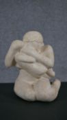 A 20th century carved limestone sculpture of mother and child. H.32 W.19 D.20cm