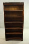 A mahogany bookcase, with a dentil cornice over five shelves, on shaped bracket feet. H.170 W.80 D.