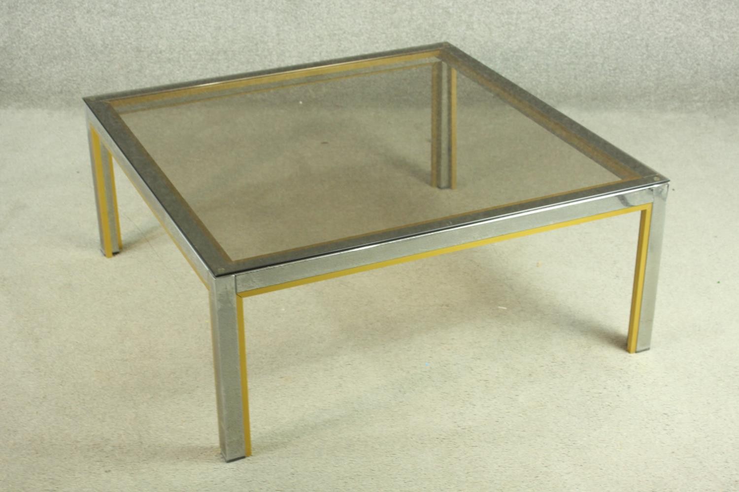 Manner of Janetti, a 1970's coffee table, with a tinted glass coffee top on a chrome and brass - Image 3 of 4