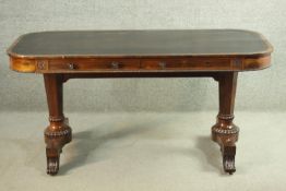 A William IV rosewood library table, with a tooled brown leather skiver, over two short frieze