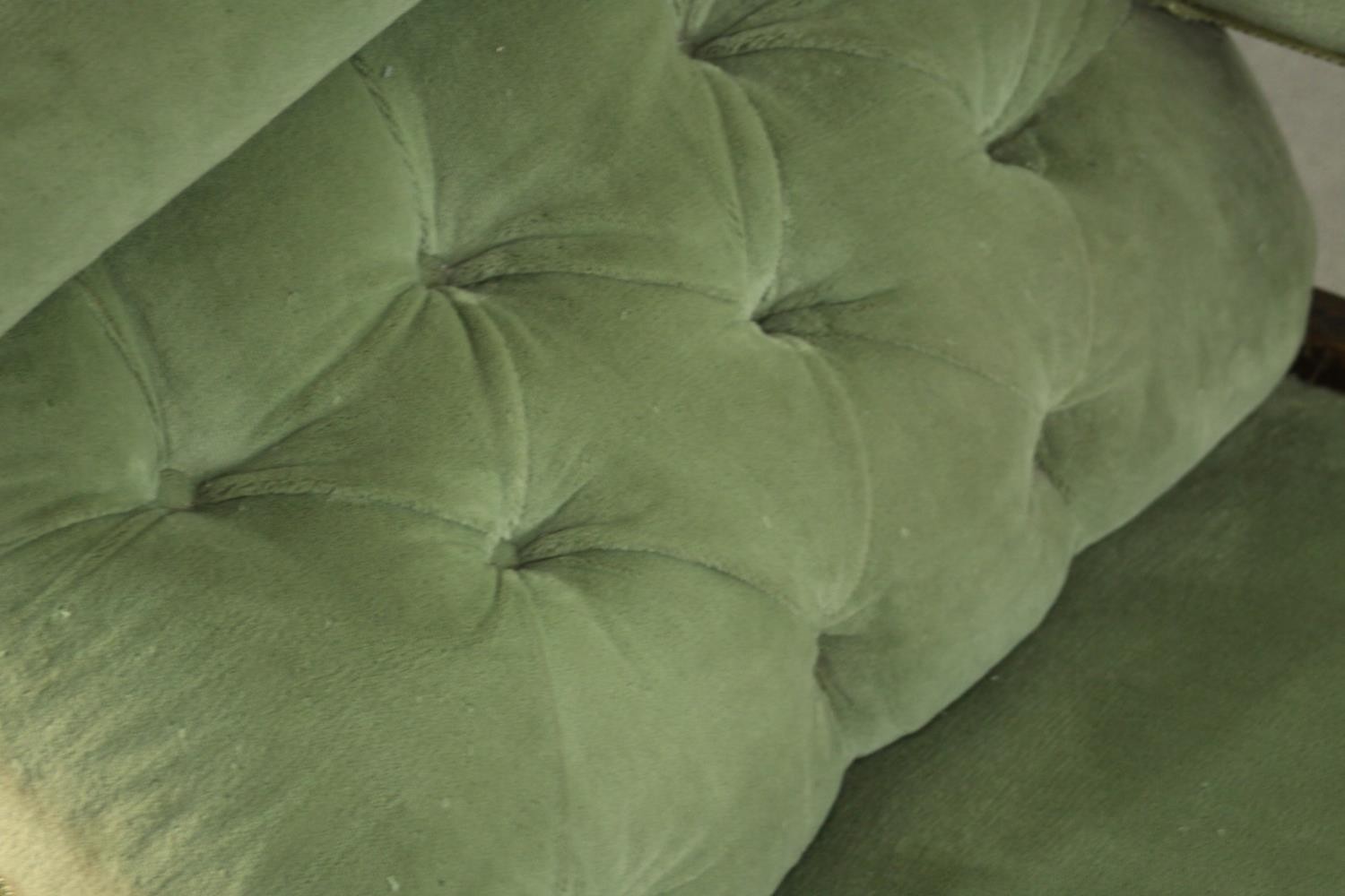 An Edwardian chaise longue, upholstered in green buttoned velour, the back panel carved and - Image 8 of 8