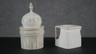 A ceramic biscuit tin in the form of Royal Pavilion, Brighton along with a Great Western Railway