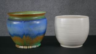 A large hand painted Shell blue, green and brown planter along with a Clarice Cliff cream glaze