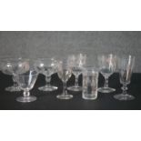 A collection of eight 19th and early 20th century etched drinking glass, each with a different