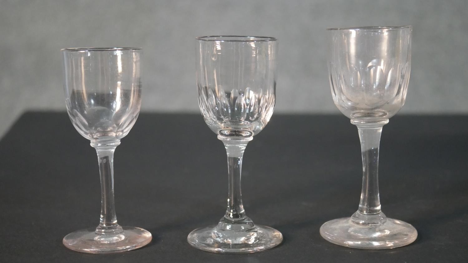 A collection of nine 19th and early 20th century petal faceted glass stemmed drinking glasses, - Image 2 of 5
