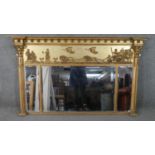 A Regency giltwood triple bevelled plate over mantle mirror with chariot frieze, inverted cornice