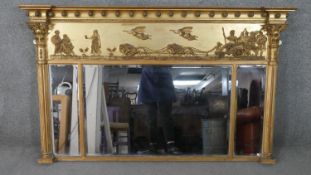 A Regency giltwood triple bevelled plate over mantle mirror with chariot frieze, inverted cornice