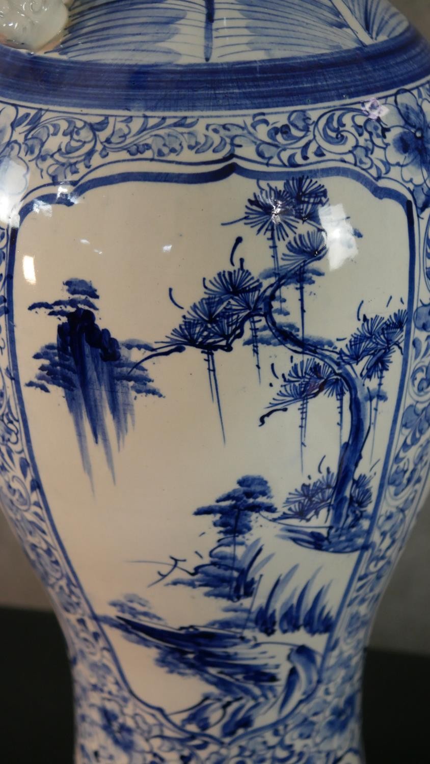 A large blue and white Chinese porcelain twin handled vase, one side decorated with a river scene - Image 5 of 9