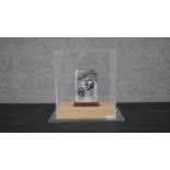 A perspex cased 21st century bronze double sided portrait sculpture. Unsigned. H.13.5 W.9.5 D.3cm