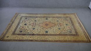 A Persian Kashan biscuit ground hand made rug. L.217 W.136cm.