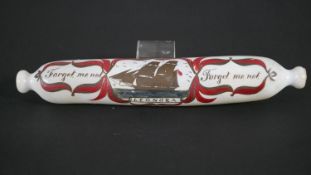 A Victorian milk glass rolling pin with hand painted design, the Leonora sailing ship inscribed '