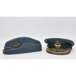 Two vintage military caps with retailers box. A RAF Cold War period Air Officers side cap by