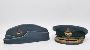 Two vintage military caps with retailers box. A RAF Cold War period Air Officers side cap by
