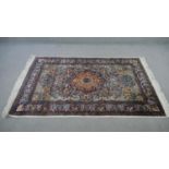 An India silk Kashmir cream ground hand made rug. L.183 W.122cm