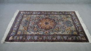 An India silk Kashmir cream ground hand made rug. L.183 W.122cm